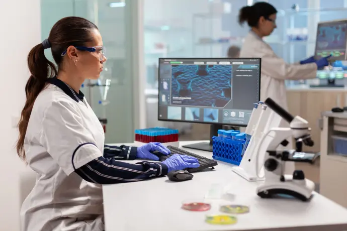 A medical researcher is working on developing a new vaccine in a modern laboratory